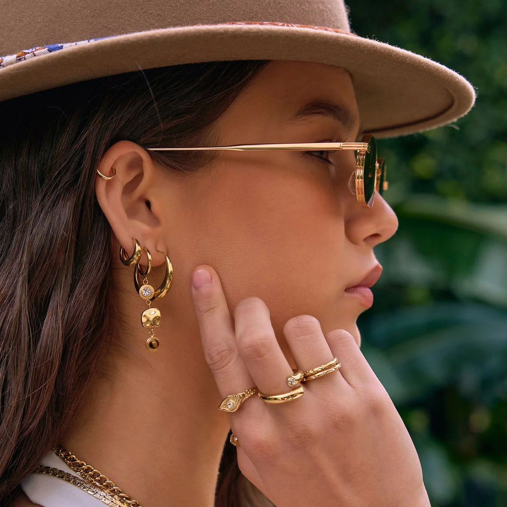 
                      
                        Arms of Eve - Indie Hoop Earrings in Gold
                      
                    